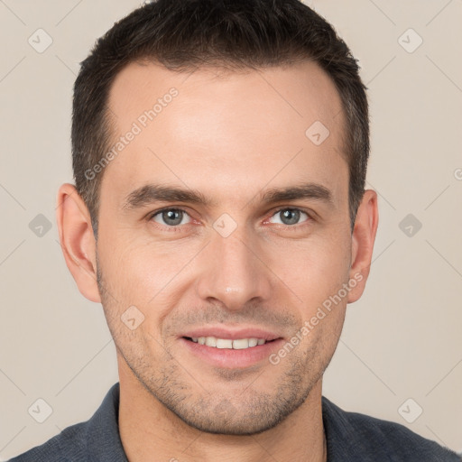 Joyful white young-adult male with short  brown hair and brown eyes