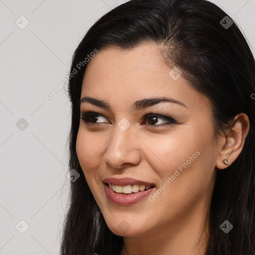 Joyful latino young-adult female with long  brown hair and brown eyes