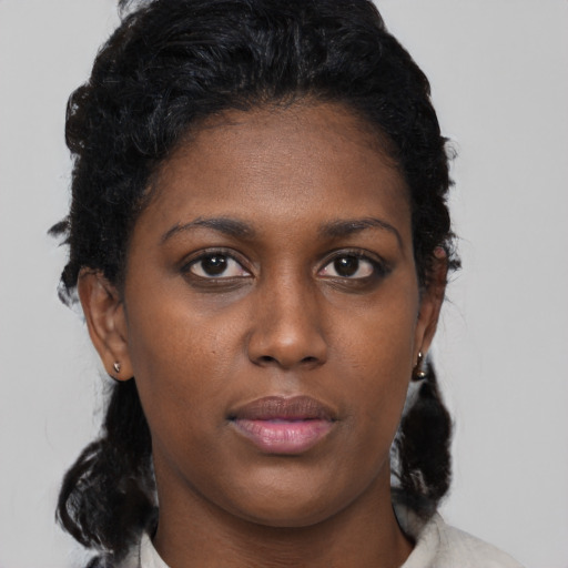 Neutral black young-adult female with medium  black hair and brown eyes