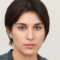 Neutral white young-adult female with short  brown hair and brown eyes