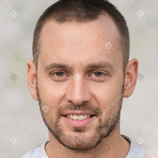 Joyful white adult male with short  brown hair and brown eyes