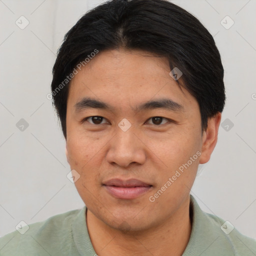 Joyful asian young-adult male with short  brown hair and brown eyes