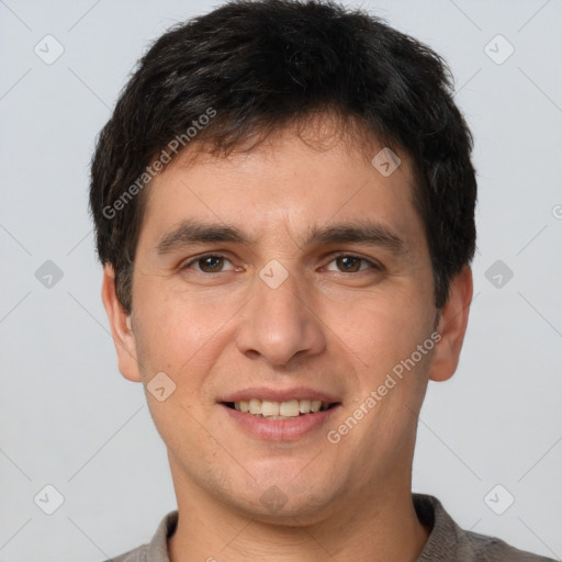 Joyful white young-adult male with short  brown hair and brown eyes