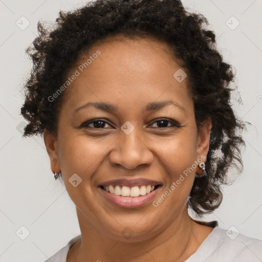 Joyful black adult female with short  brown hair and brown eyes