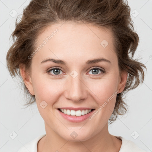 Joyful white young-adult female with medium  brown hair and green eyes