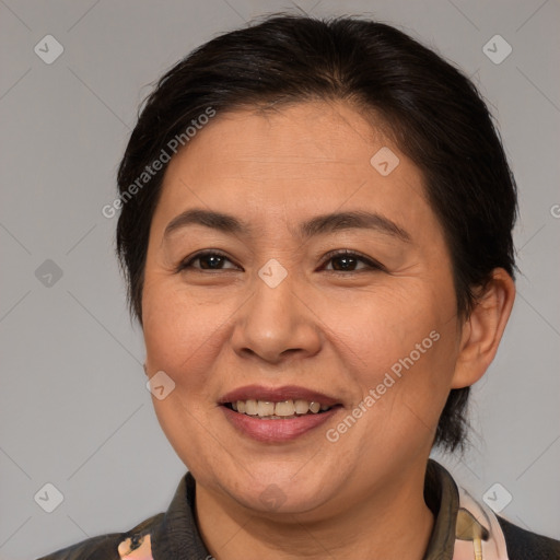 Joyful white adult female with medium  brown hair and brown eyes