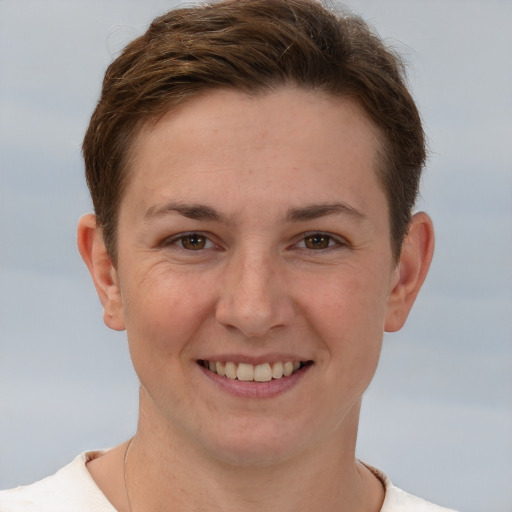 Joyful white young-adult female with short  brown hair and brown eyes