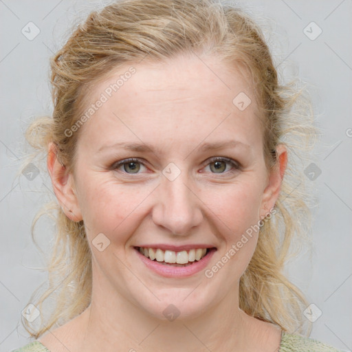 Joyful white young-adult female with medium  brown hair and blue eyes