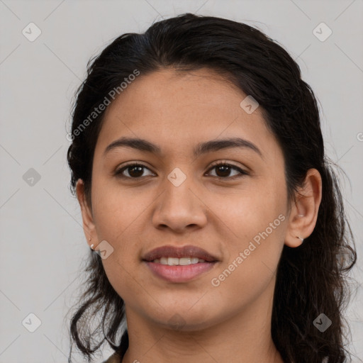 Joyful latino young-adult female with long  brown hair and brown eyes