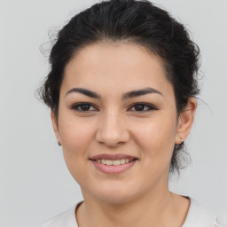 Joyful asian young-adult female with medium  brown hair and brown eyes