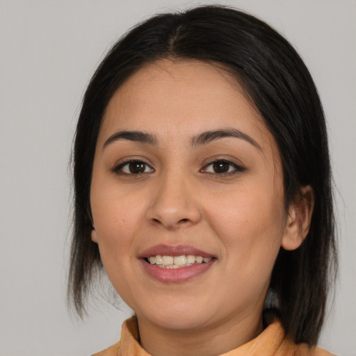 Joyful white young-adult female with medium  brown hair and brown eyes