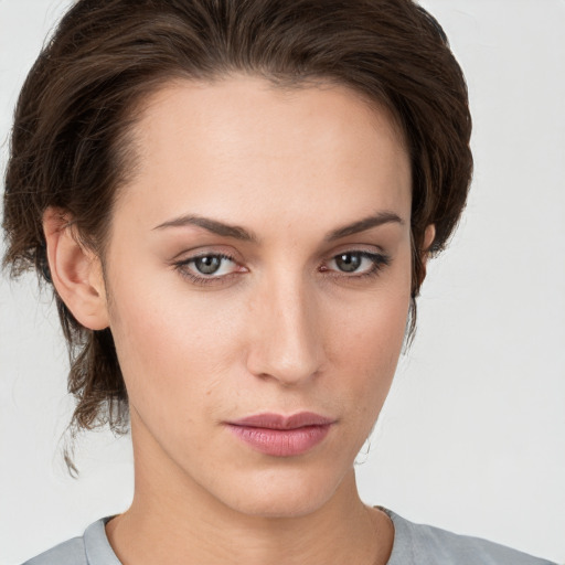 Neutral white young-adult female with medium  brown hair and grey eyes