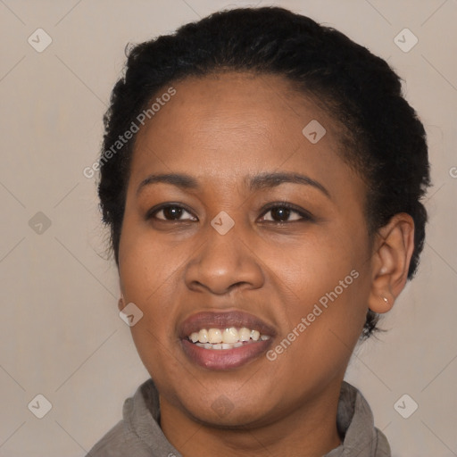 Joyful black young-adult female with short  black hair and brown eyes