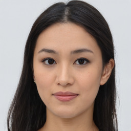 Joyful asian young-adult female with long  brown hair and brown eyes