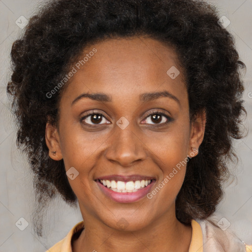 Joyful black young-adult female with medium  brown hair and brown eyes