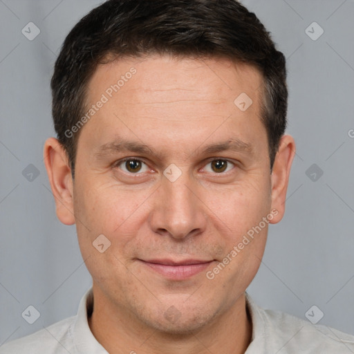 Joyful white adult male with short  brown hair and brown eyes