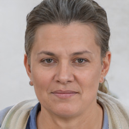 Joyful white adult female with short  brown hair and brown eyes