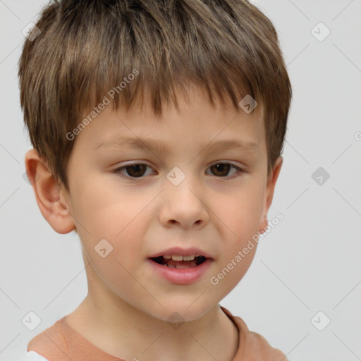 Joyful white child male with short  brown hair and brown eyes