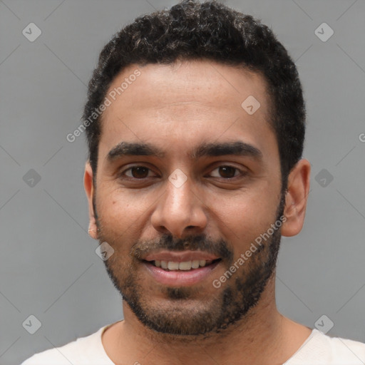 Joyful white young-adult male with short  black hair and brown eyes