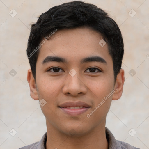 Joyful asian young-adult male with short  black hair and brown eyes