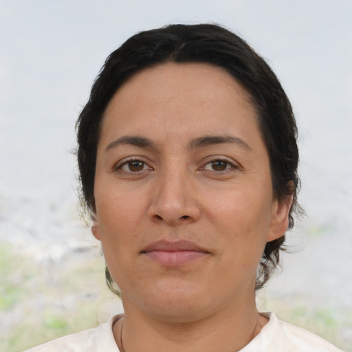 Joyful asian adult female with short  brown hair and brown eyes