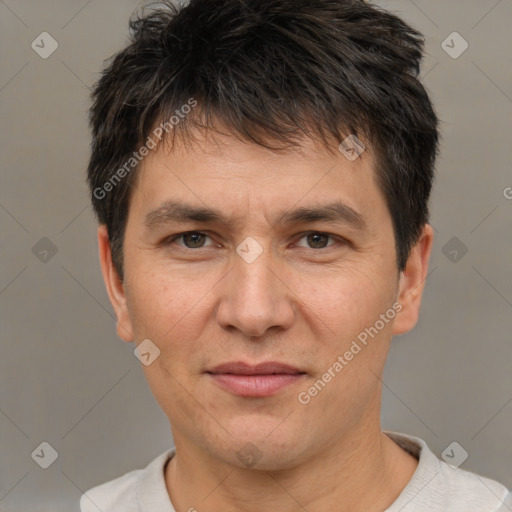 Joyful white adult male with short  brown hair and brown eyes