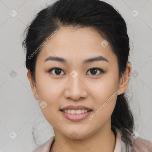 Joyful latino young-adult female with medium  black hair and brown eyes