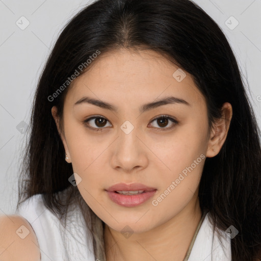 Joyful asian young-adult female with long  brown hair and brown eyes