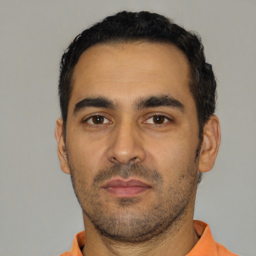 Neutral latino adult male with short  black hair and brown eyes