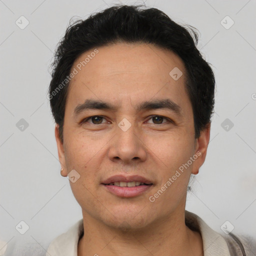 Joyful white adult male with short  black hair and brown eyes