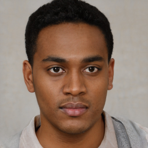 Neutral latino young-adult male with short  brown hair and brown eyes