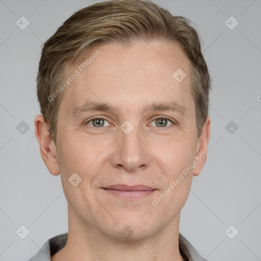 Joyful white adult male with short  brown hair and grey eyes