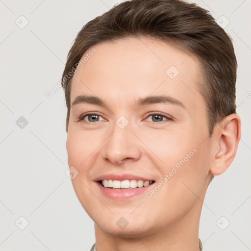 Joyful white young-adult female with short  brown hair and brown eyes