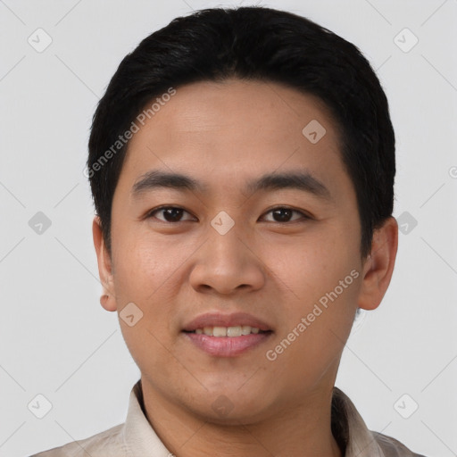 Joyful asian young-adult male with short  black hair and brown eyes