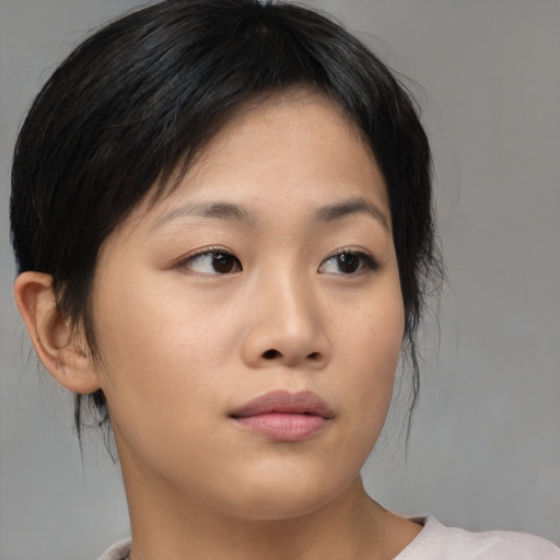 Neutral asian young-adult female with medium  brown hair and brown eyes