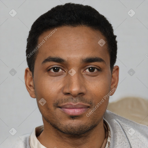 Joyful black young-adult male with short  black hair and brown eyes