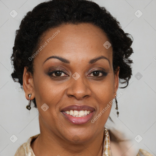 Joyful black adult female with short  brown hair and brown eyes