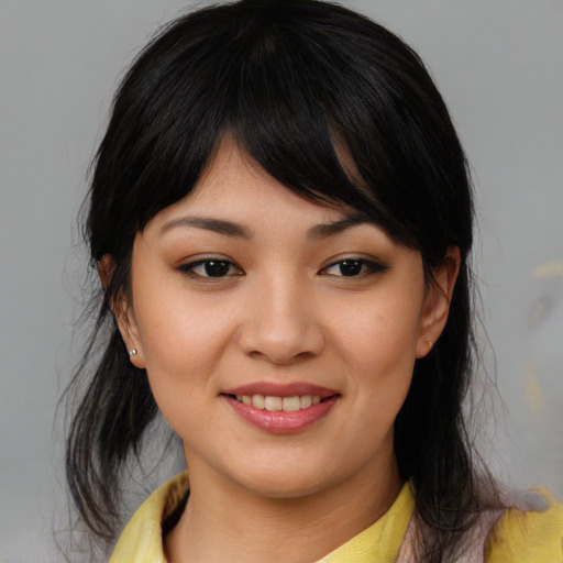 Joyful asian young-adult female with medium  black hair and brown eyes