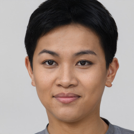 Joyful asian young-adult female with short  black hair and brown eyes