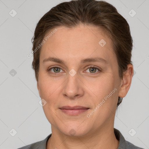 Joyful white adult female with short  brown hair and grey eyes