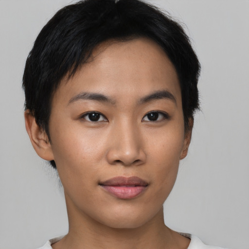 Joyful asian young-adult female with short  black hair and brown eyes