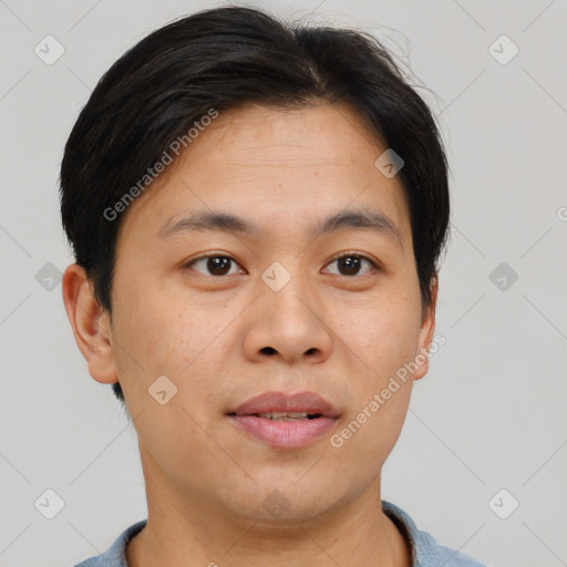 Joyful asian young-adult male with short  brown hair and brown eyes