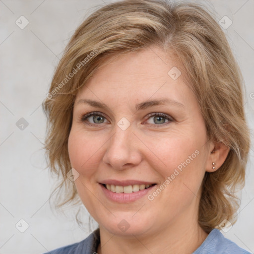 Joyful white young-adult female with medium  brown hair and blue eyes