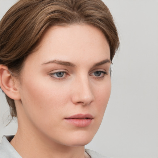 Neutral white young-adult female with medium  brown hair and grey eyes