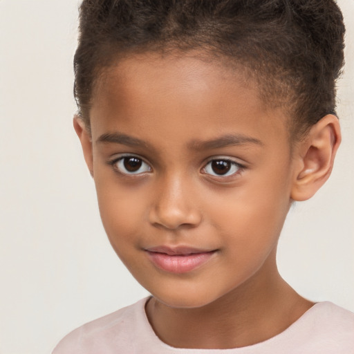 Joyful white child male with short  brown hair and brown eyes