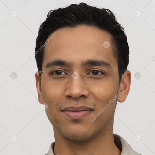 Joyful asian young-adult male with short  black hair and brown eyes