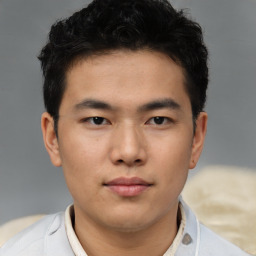 Neutral asian young-adult male with short  brown hair and brown eyes