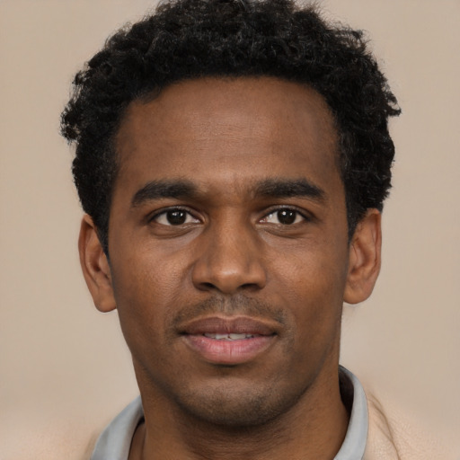 Neutral black young-adult male with short  black hair and brown eyes