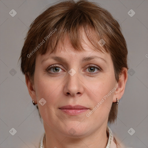 Joyful white adult female with medium  brown hair and grey eyes