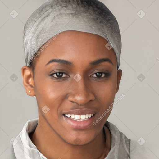 Joyful black young-adult female with short  black hair and brown eyes